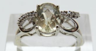 A 9ct gold ring set with a lemon quartz and diamonds, size N, 2.
