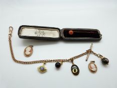 A plaited fob chain with a 14k gold charm (1.