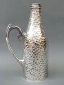 A plated folding wine bottle holder / carrier of hammered design (splits to accommodate bottle)