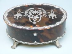 A hallmarked silver and tortoiseshell oval lidded dressing table pot London 1906 maker's mark