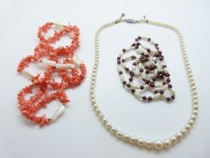 A single strand of cultured pearls with white metal clasp set with diamonds,