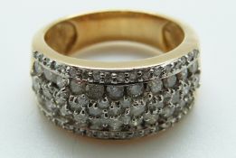 An 18ct gold ring set with diamonds in rows, size P,