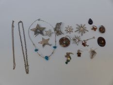 A silver and paste star brooch, silver and pressed amber pendant, marcasite brooch, silver chains,