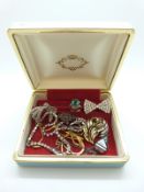 A silver ring set with turquoise, a silver pendant and chain, paste bow brooch, a paste necklace,