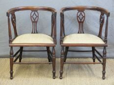 A pair of late 19thC bow backed inlaid armchairs
