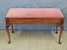 A modern duet piano stool