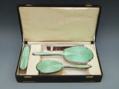 A Selfridge & Co Ltd George VI hallmarked silver and guilloché enamel dressing table set comprising
