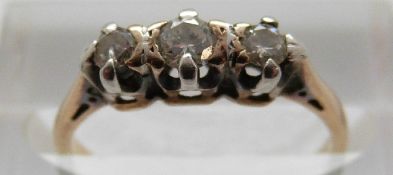 An 18ct gold ring set with three diamonds in a platinum setting, size I,