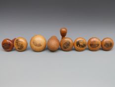 Nine 19th/20thC Mauchline ware darning/sewing mushrooms comprising boat landing Derwent Water,