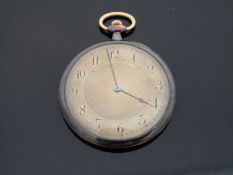 A yellow metal cased slim Art Deco style continental pocket watch with keyless wind movement and