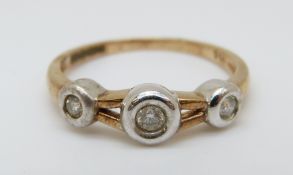 A 9ct gold bi-coloured ring set with three diamonds, 2.