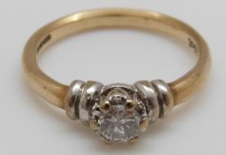 A 9ct gold ring set with a round cut diamond of approximately 0.