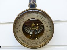 Martin & Co, Paris and Cheltenham, holosteric aneroid barometer in brass circular case.