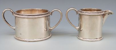 A Victorian hallmarked silver sugar bowl and milk jug of cylindrical form with beaded edge,