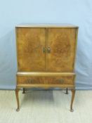 A walnut cocktail cabinet,