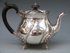 A Victorian hallmarked silver teapot with wrythen embossed decoration,
