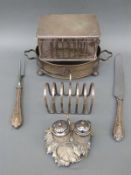 Goldsmiths and Silversmiths hinged lidded biscuit tin with looped lion mask handles, toast rack,