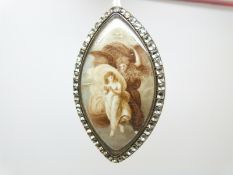 A Georgian/ Victorian brooch/ pendant set with a marquise shaped ivory miniature depicting a woman