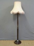 A wooden standard lamp