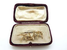 A Victorian 15ct gold brooch in the form of three swallows set with seed pearls,