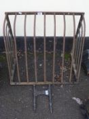 A vintage hay rack and foot scraper