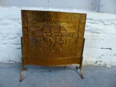 An embossed copper fire screen