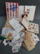 A box of stamps loose and in albums including a range of West Indies George V stamps mint and used,