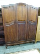 An Eastern hardwood panelled wardrobe or compactum,