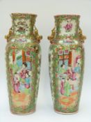 A pair of Chinese Cantonese famille rose vases depicting court scenes,