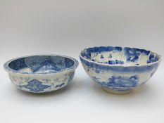 A Chinese blue and white bowl with bird and foliate decoration and another bowl
