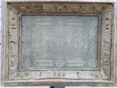 A middle Eastern/ Islamic brass or similar panel with engraved Islamic script,