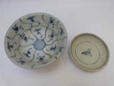 A Chinese blue and white bowl and another similar shallow bowl,