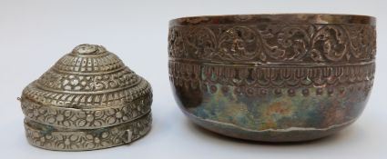 A white metal Tibetan alms bowl and a betel nut box