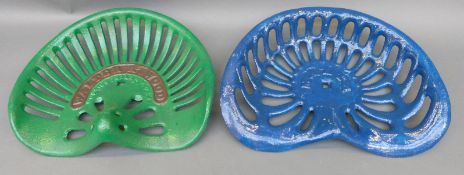 Two cast iron tractor or implement seats, one Walter A.