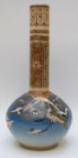 A 19thC Japanese bottle vase decorated with storks on a blue ground with gilt detail to the neck,