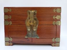 A Chinese brass bound elm jewellery chest,