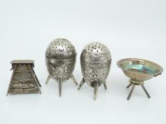 Two Chinese white metal salts with floral decoration,