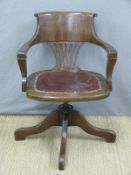 A vintage oak and leather swivel/office or captain's chair