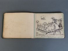 An early twentieth century album of autographs some with drawings including a man having a