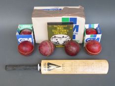A miniature autographed cricket bat, autographs include Chris Broad,