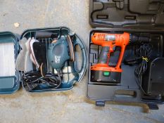 A Black & Decker sander and cordless drill