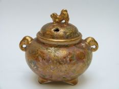 A Japanese signed Satsuma footed koro with figural elephant handles and mark to base,