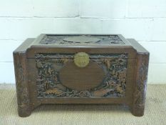A Chinese carved camphorwood chest