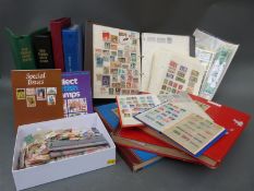A box of all-world stamps including three albums,