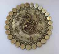 A Chinese brass plaque with dragon decoration,