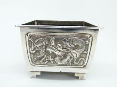 A Chinese silver jardiniere with repoussé decoration of dragons, bamboo and prunus blossom,