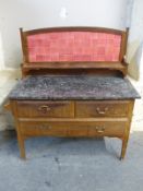 A marble topped tile back washstand,
