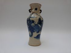 A Chinese blue and white crackle glaze vase with warrior decoration and mark to base,