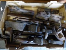 A quantity of vintage woodworking planes and tools