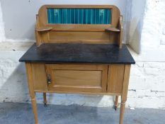 A satinwood tile back washstand,